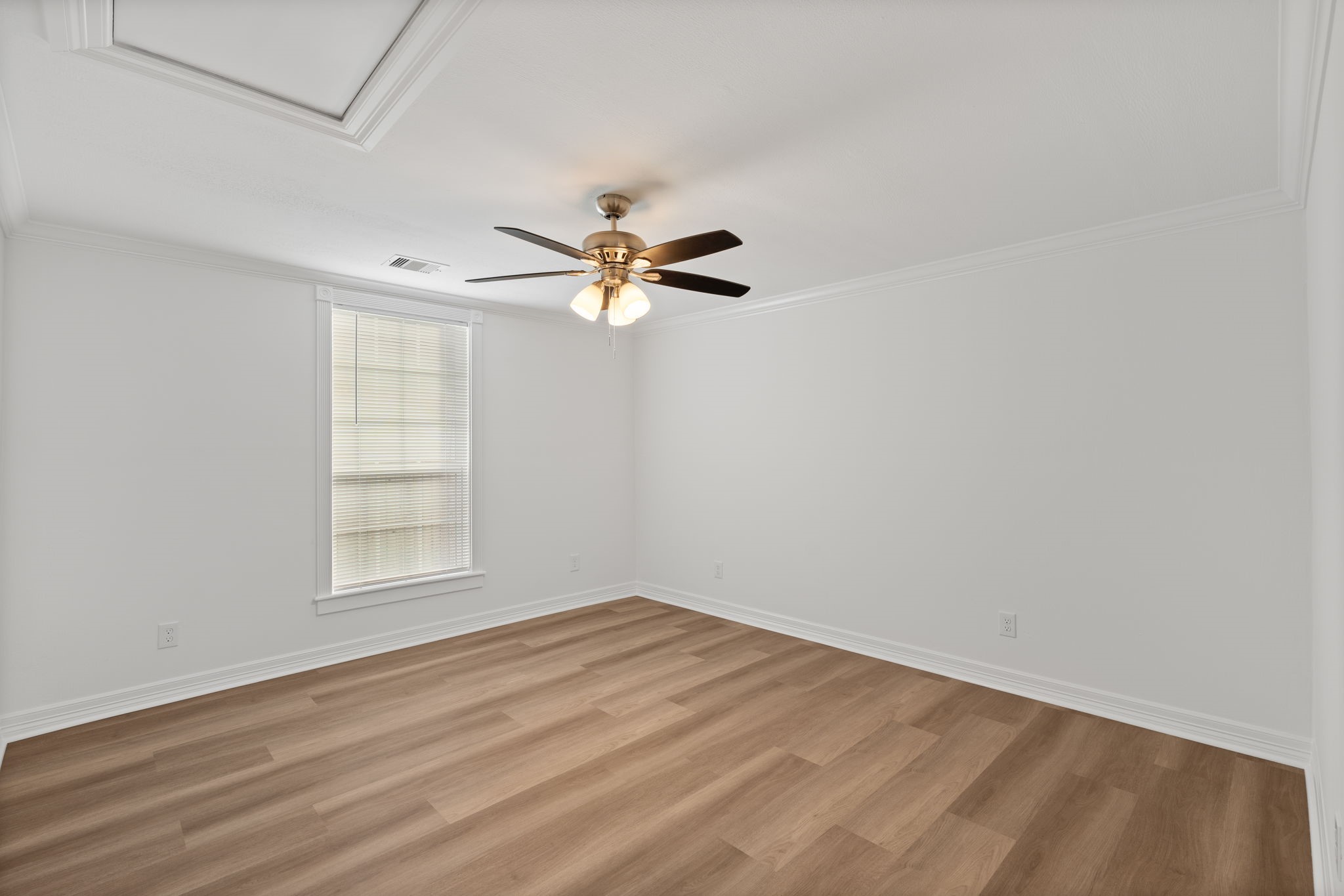203 Archer Street Houston, TX 77009 - Photo 29 of 43 an empty room with wooden floor fan and windows