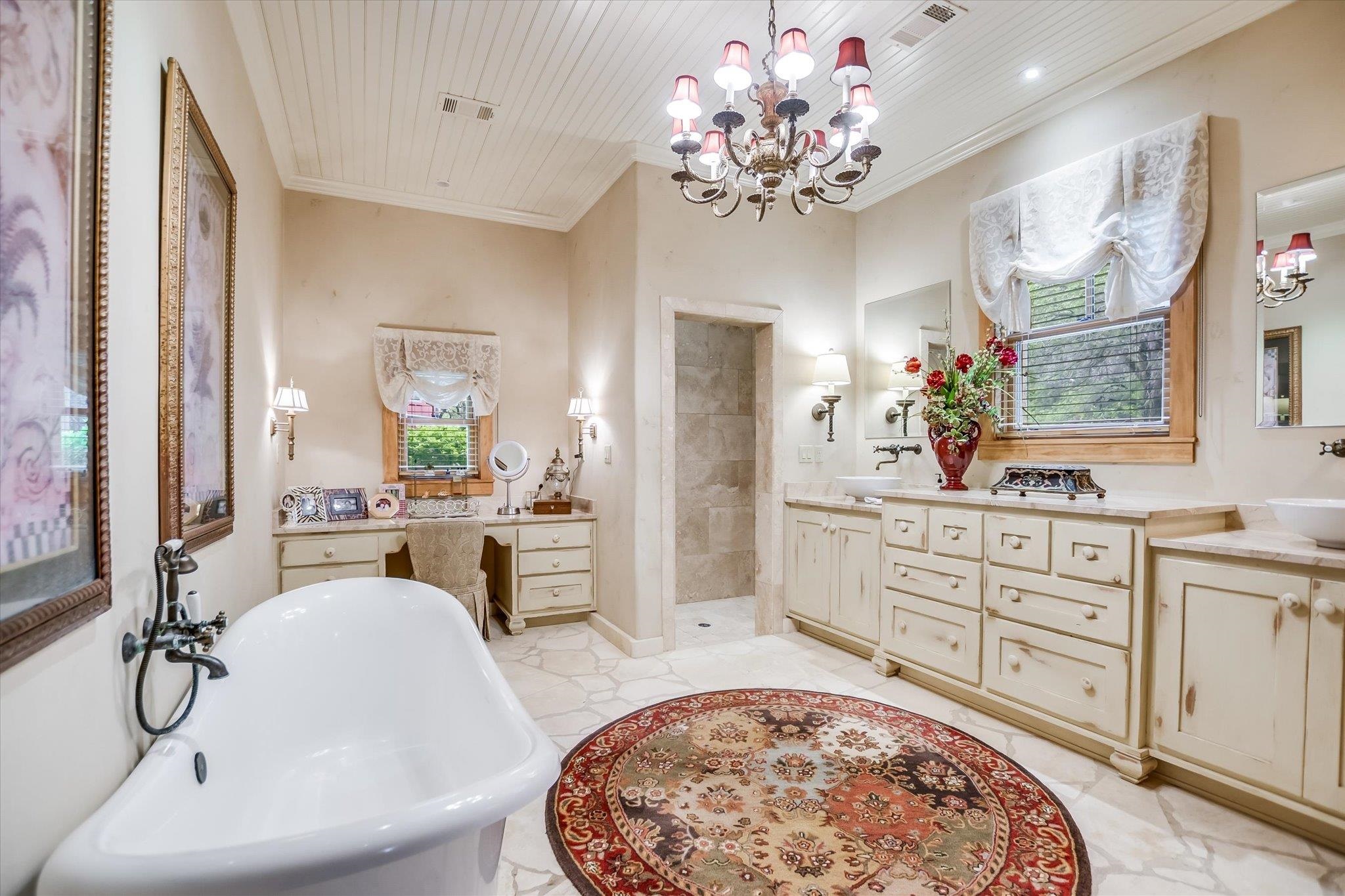 170 Sandstone Ridge Drive Marble Falls, TX 78654 - Photo 18 of 38 a spacious bathroom with a sink double vanity and a mirror