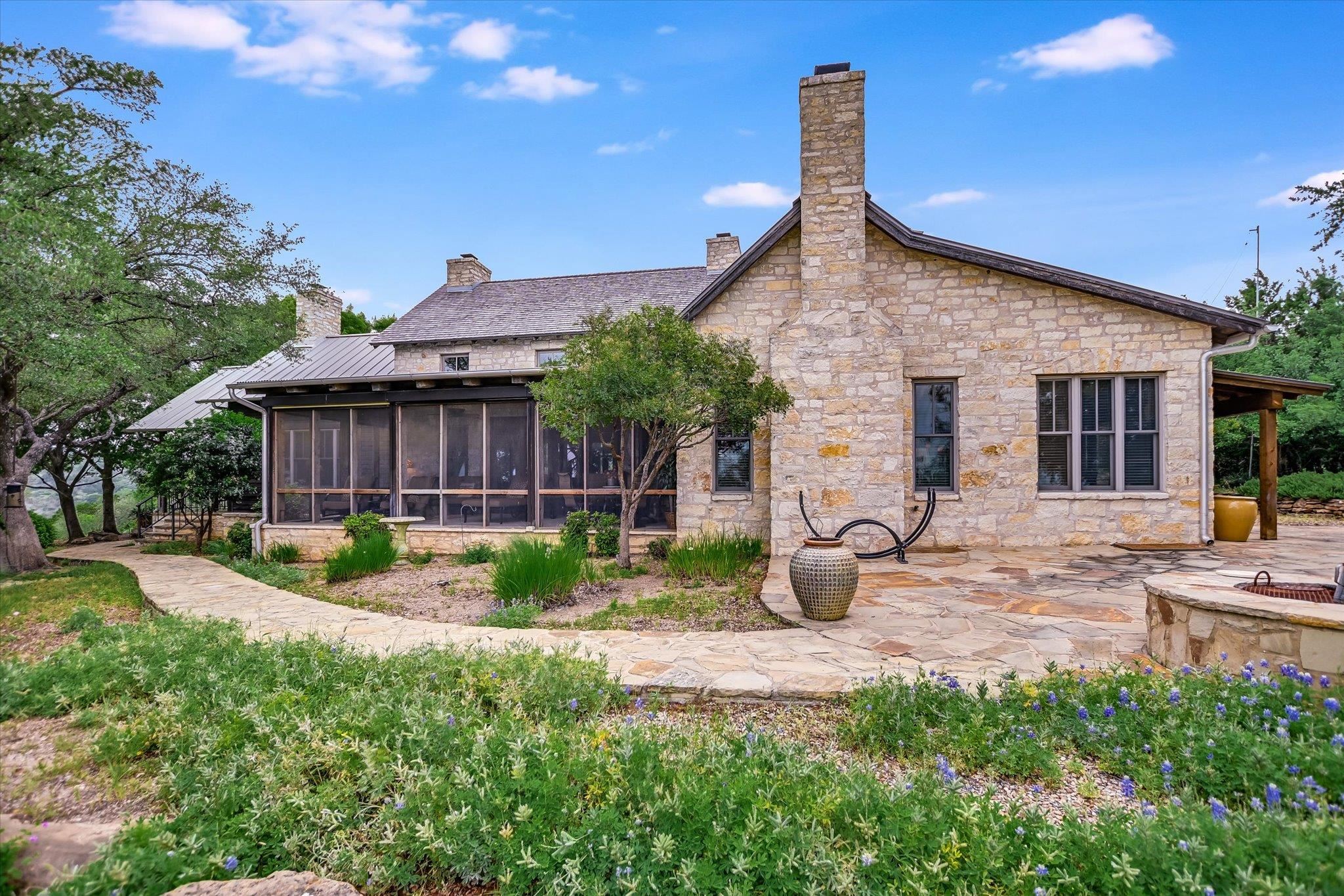 170 Sandstone Ridge Drive Marble Falls, TX 78654 - Photo 27 of 38 a view of a house with backyard and sitting area