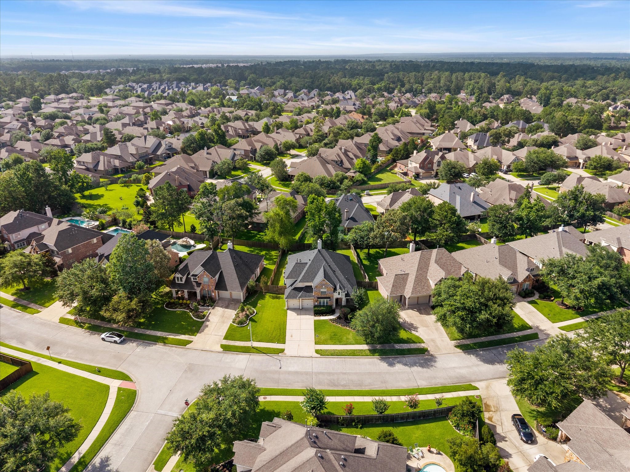 323 Arbor Ridge Lane Conroe, TX 77384 - Photo 40 of 40 Surrounded by green as far as you can see. Mature trees, winding streets, and the Piney Woods right at the edge. Close to everything, but it sure doesn't feel like it.