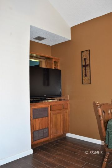 417 Montefino Drive Ridgecrest, CA 93555 - Photo 5 of 25 a room with wooden floor and furniture