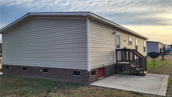 a view of a house with a yard and garage