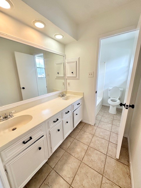17719 Cassina Drive Spring, TX 77388 - Photo 16 of 19 a spacious bathroom with a double vanity sink mirror and toilet