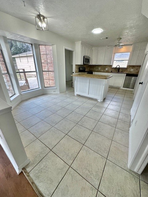17719 Cassina Drive Spring, TX 77388 - Photo 6 of 19 a large kitchen with a stove a sink dishwasher and a refrigerator