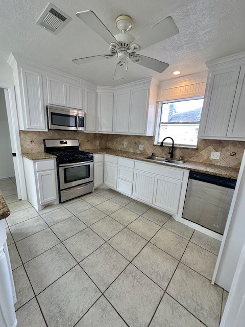 17719 Cassina Drive Spring, TX 77388 - Photo 7 of 19 a kitchen with granite countertop a sink cabinets and stainless steel appliances