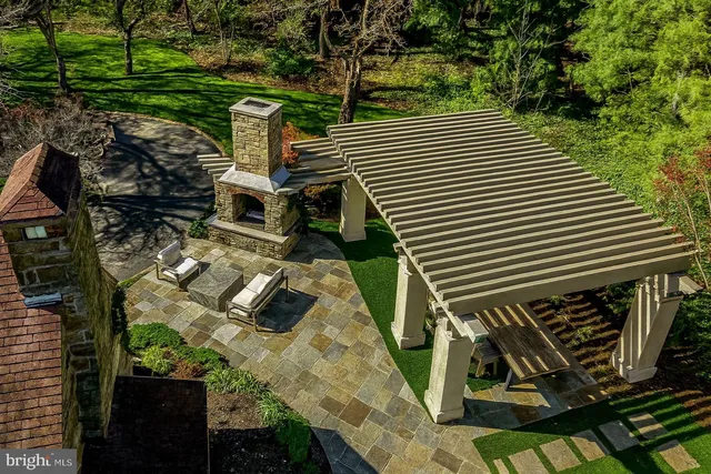 a view of a big yard with large trees