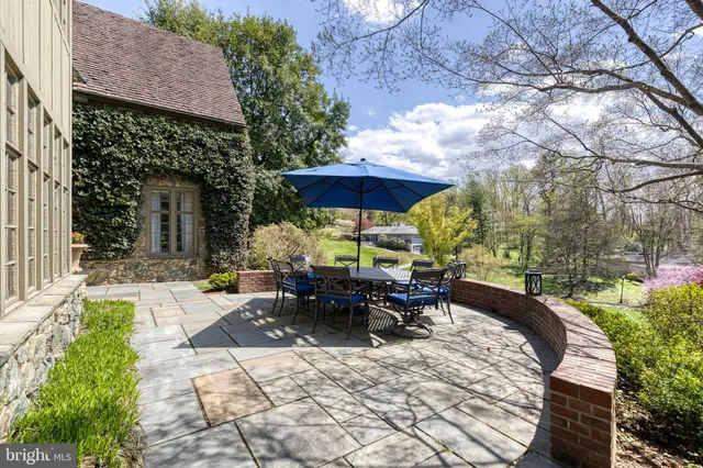 a view of a house with a yard and garage