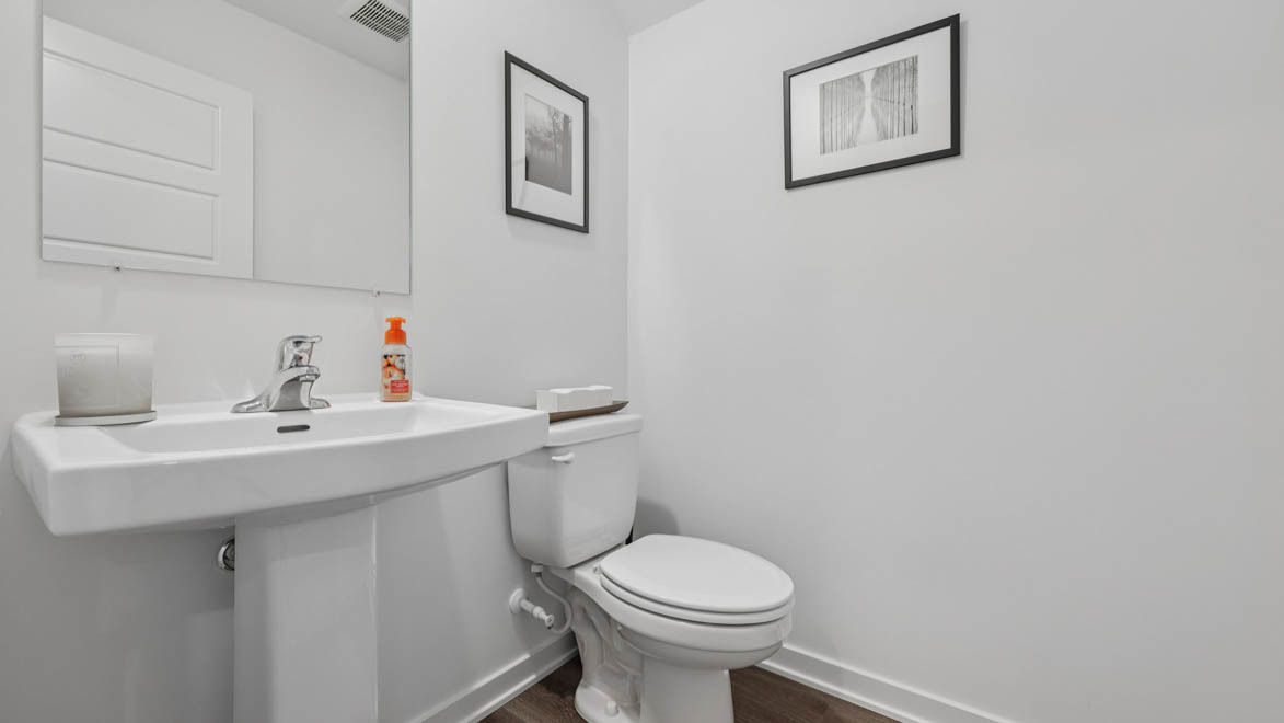 7105 Fair Oaks Road, Unit 38 Racine, WI 53403 - Photo 15 of 30 a bathroom with a sink toilet and a mirror