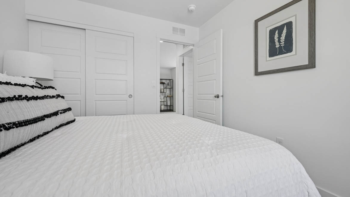 7105 Fair Oaks Road, Unit 38 Racine, WI 53403 - Photo 20 of 30 a bedroom with a bed and cabinets