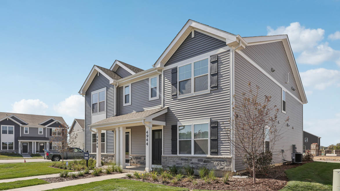 7105 Fair Oaks Road, Unit 38 Racine, WI 53403 - Photo 2 of 30 a view of a building with a yard