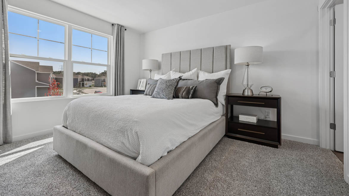 7105 Fair Oaks Road, Unit 38 Racine, WI 53403 - Photo 25 of 30 a bed room with a bed and a window