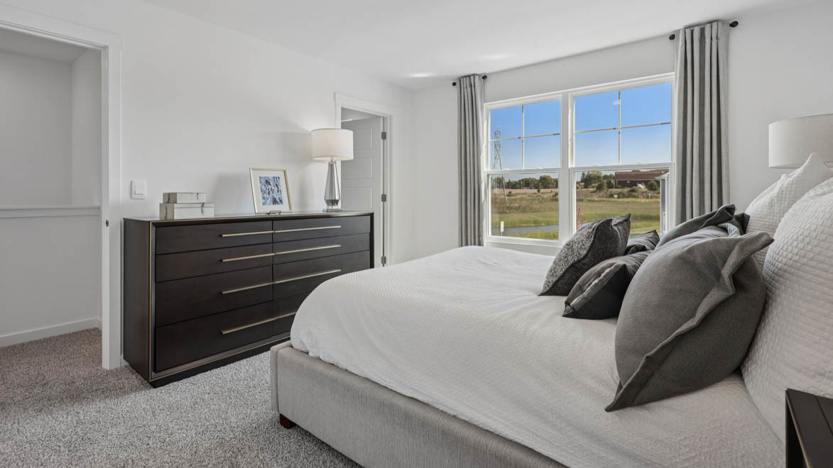 7105 Fair Oaks Road, Unit 38 Racine, WI 53403 - Photo 26 of 30 a bedroom with a bed and a window