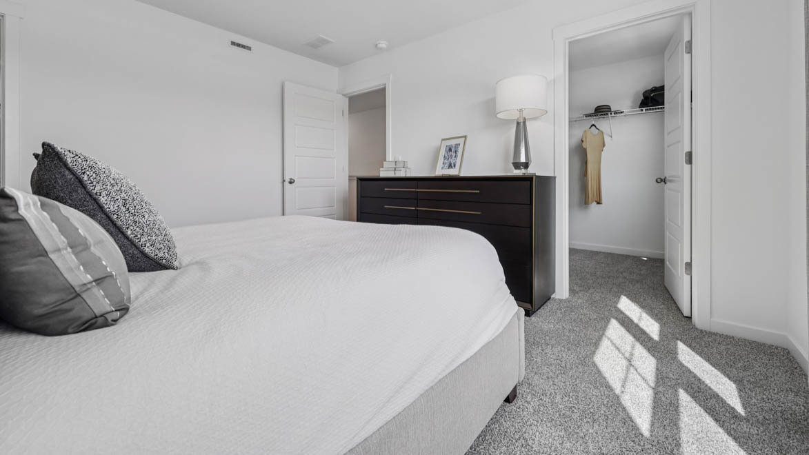 7105 Fair Oaks Road, Unit 38 Racine, WI 53403 - Photo 28 of 30 a bedroom with a bed and a table in it