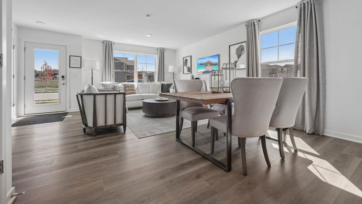 7105 Fair Oaks Road, Unit 38 Racine, WI 53403 - Photo 8 of 30 a living room with furniture a large window and wooden floor