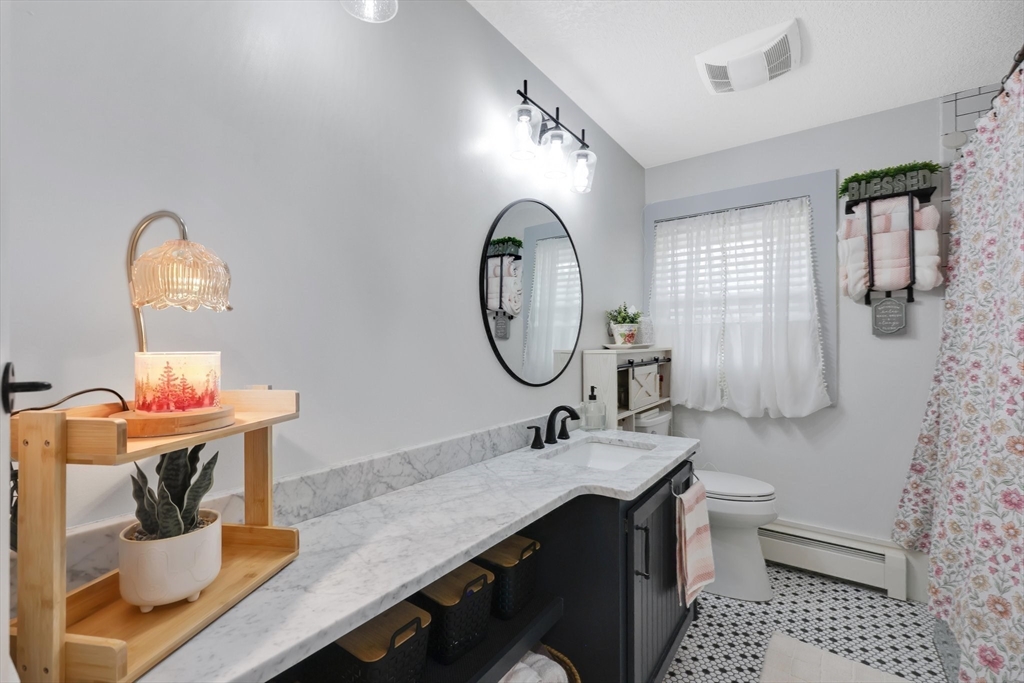 17 Glen Drive Wilbraham, MA 01095 - Photo 17 of 42 a bathroom with a sink and a mirror