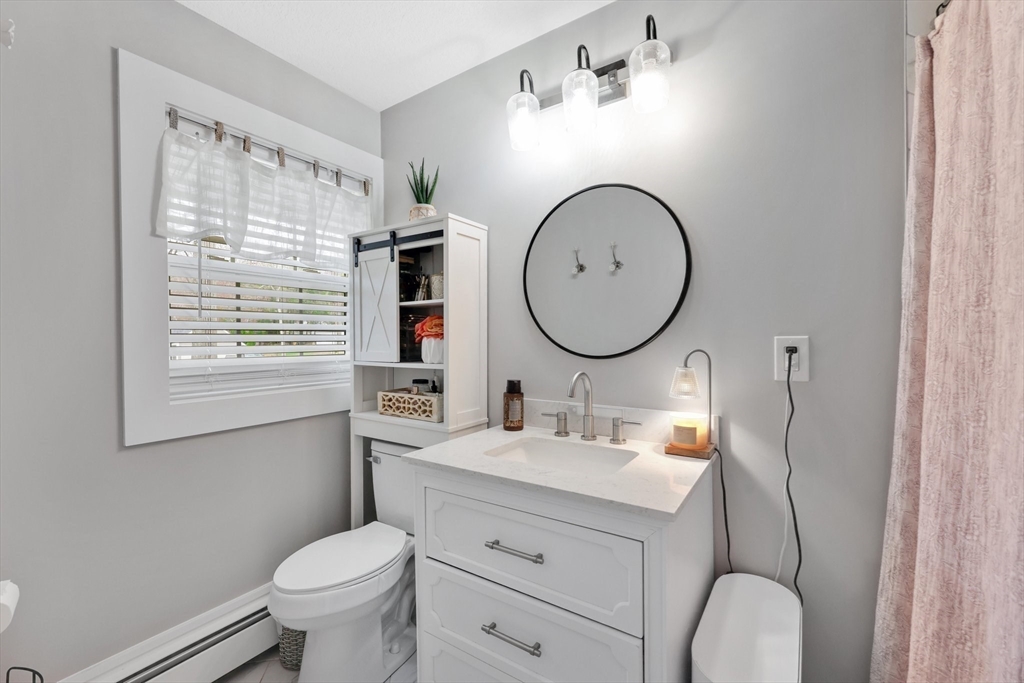 17 Glen Drive Wilbraham, MA 01095 - Photo 24 of 42 a bathroom with a toilet sink and mirror