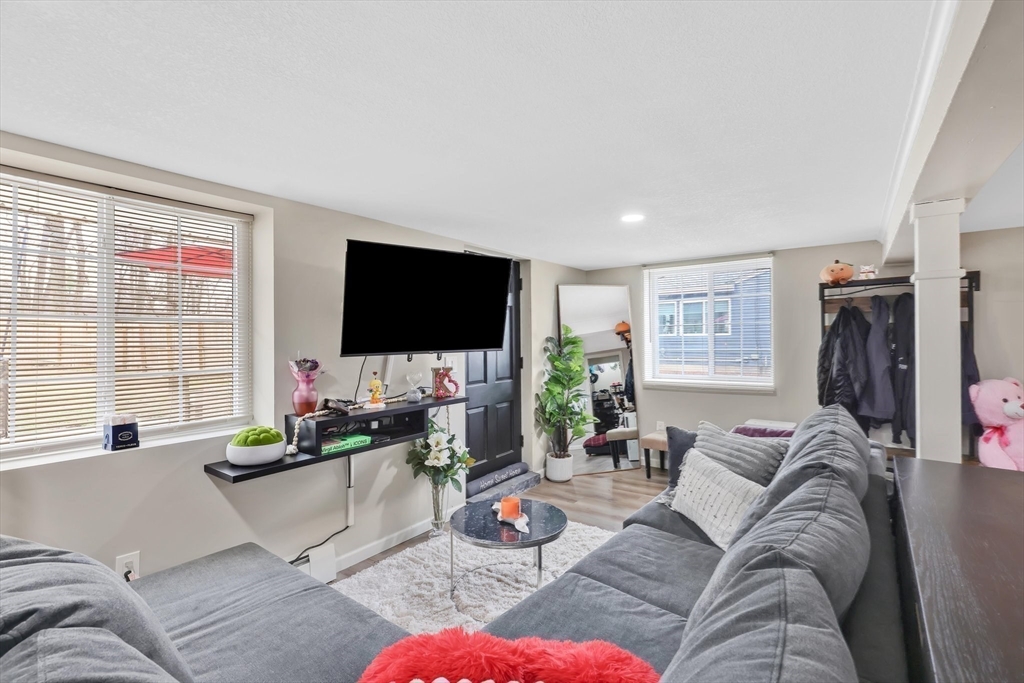 17 Glen Drive Wilbraham, MA 01095 - Photo 26 of 42 a living room with furniture and a flat screen tv
