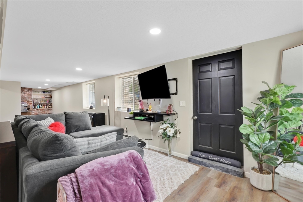 17 Glen Drive Wilbraham, MA 01095 - Photo 27 of 42 a living room with furniture and a flat screen tv
