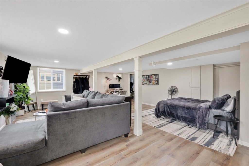 17 Glen Drive Wilbraham, MA 01095 - Photo 28 of 42 a living room with furniture and a flat screen tv