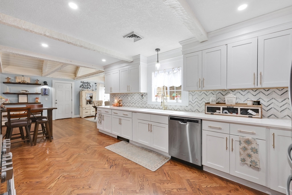 17 Glen Drive Wilbraham, MA 01095 - Photo 6 of 42 a large kitchen with stainless steel appliances granite countertop a stove and a sink