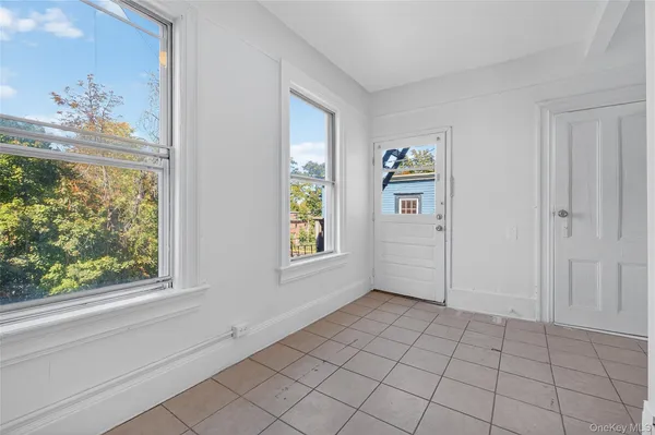 a view of an empty room and window