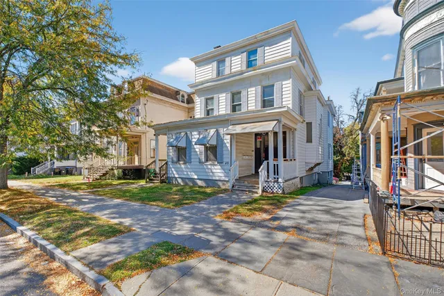 a view of a house with a yard