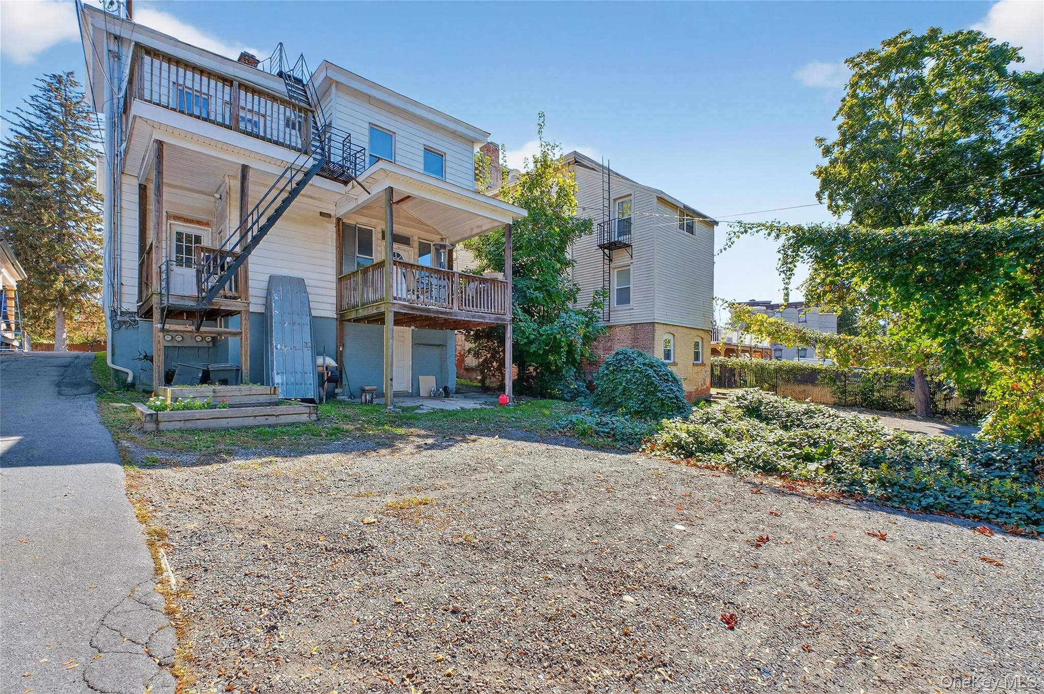 49 South Hamilton Street, Unit 2 Poughkeepsie, NY 12601 - Photo 24 of 27 a view of a house with a yard and potted plants