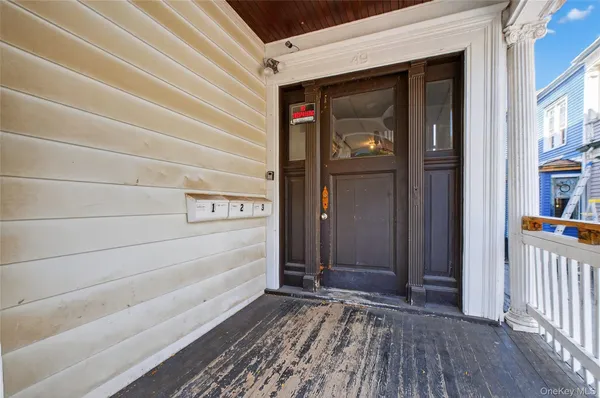 a view of a door and a window