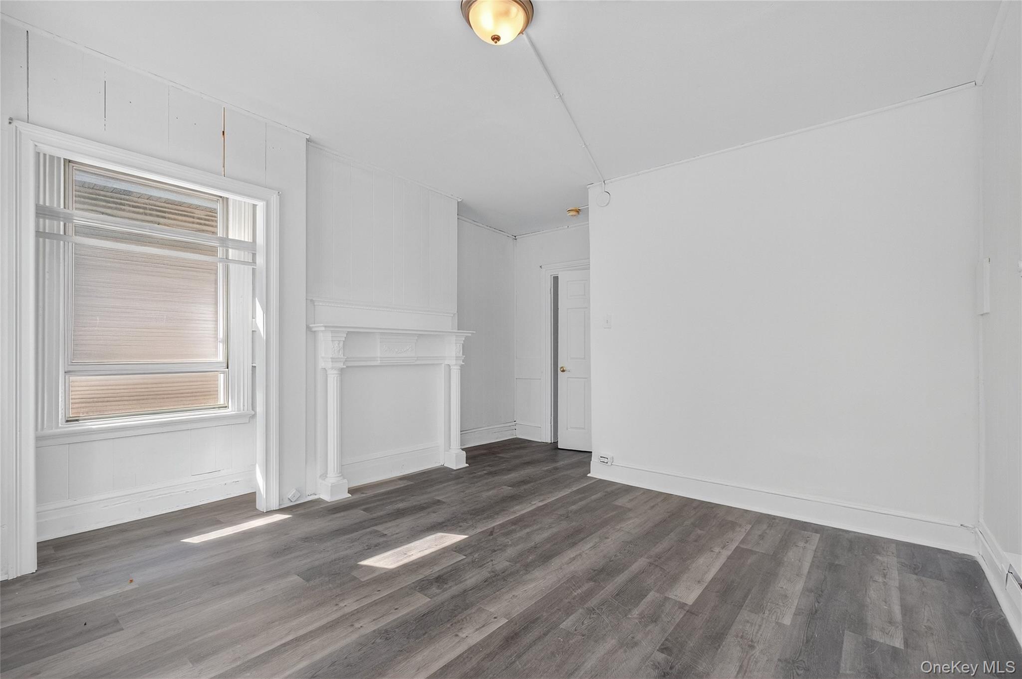 49 South Hamilton Street, Unit 2 Poughkeepsie, NY 12601 - Photo 10 of 27 a view of a room with wooden floor and window