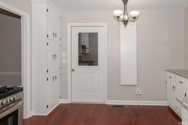 a kitchen with stainless steel appliances a stove and a refrigerator