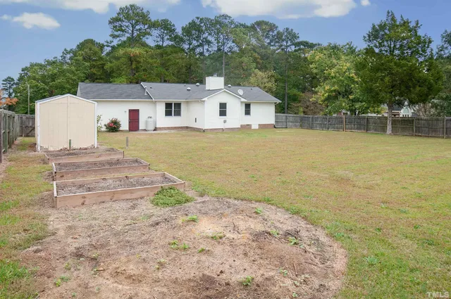 a house view with a garden space