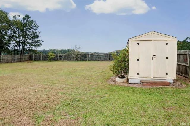 a view of a swimming pool with an outdoor space and seating area
