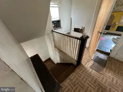 a view of a balcony with wooden floor