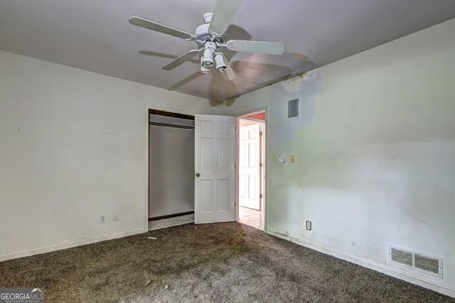 a bathroom with a sink a toilet and a shower