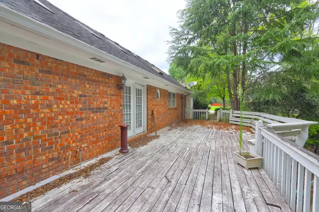a view of a house with swimming pool and sitting area