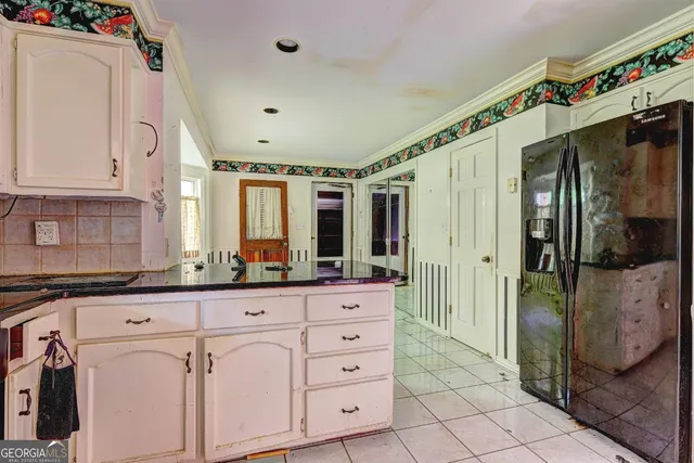 a view of a kitchen with electric appliances