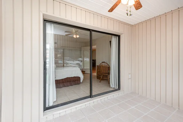 a bathroom with a glass shower door and a mirror