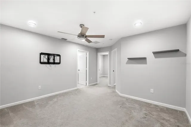 a view of an empty room with a fireplace