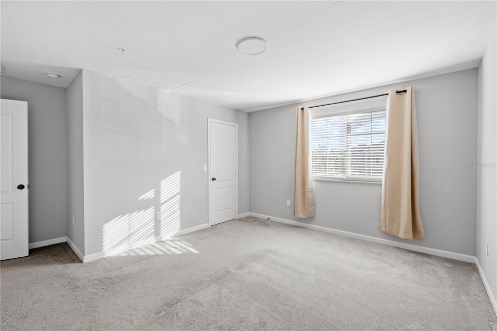 260 Smugglers Way Apopka, FL 32712 - Photo 20 of 34 a view of an empty room with a window