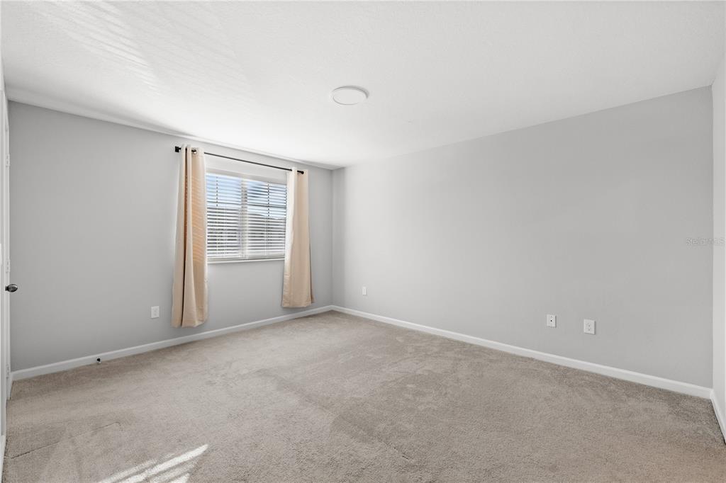 260 Smugglers Way Apopka, FL 32712 - Photo 21 of 34 a view of an empty room with a window