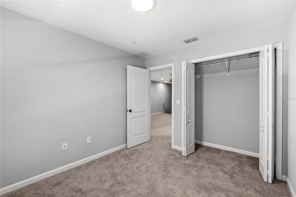 260 Smugglers Way Apopka, FL 32712 - Photo 28 of 34 an empty room with closet and a window