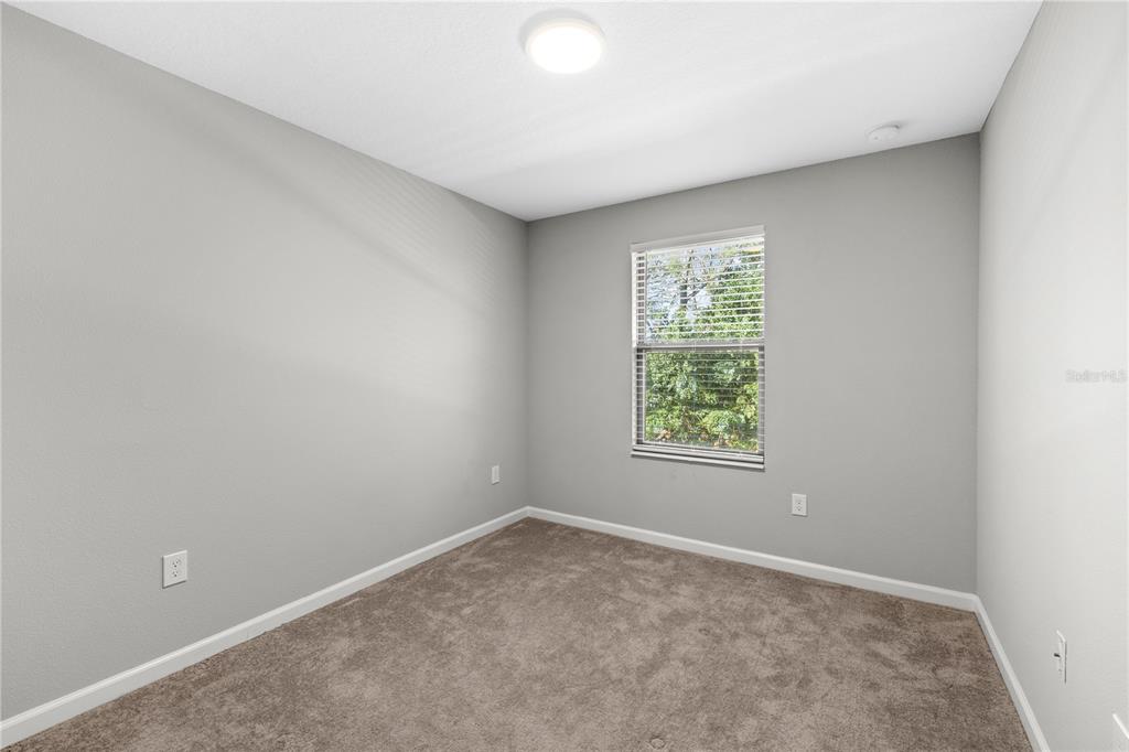 260 Smugglers Way Apopka, FL 32712 - Photo 29 of 34 an empty room with windows