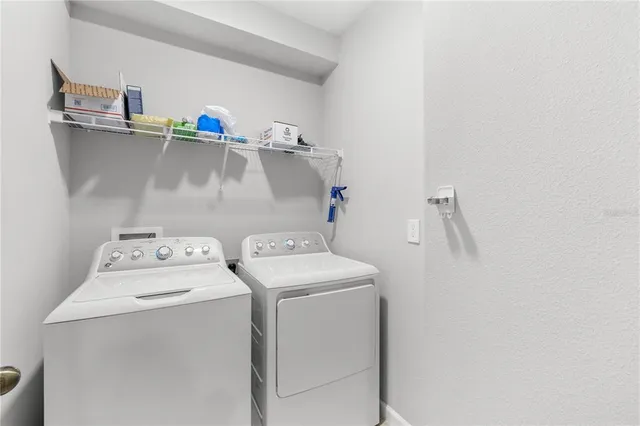 a view of a house with a backyard porch and sitting area