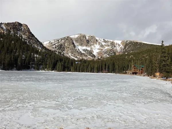 a view of mountain with sunset
