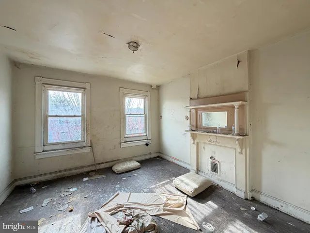 a view of a house with a snow on the road
