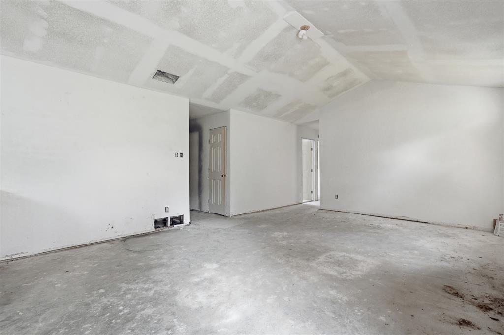 1212 Manning Road Benbrook, TX 76126 - Photo 7 of 20 Unfinished interior space featuring white walls, an unpainted ceiling, and a concrete floor