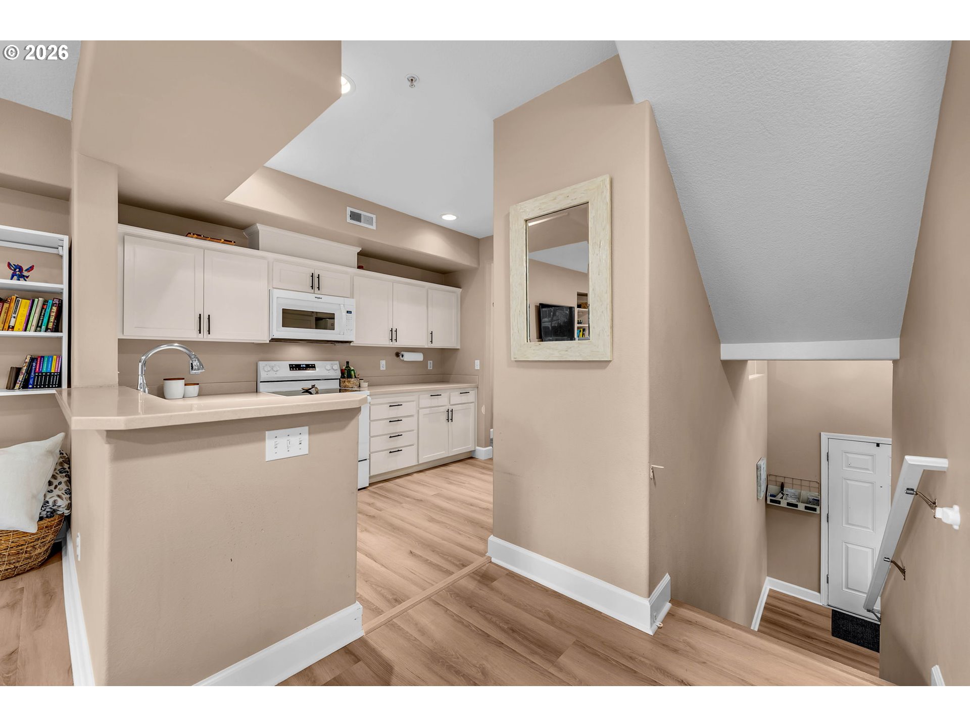 2974 Northwest Kennedy Court, Unit 1 Portland, OR 97229 - Photo 13 of 37 a kitchen with stainless steel appliances a refrigerator sink and microwave