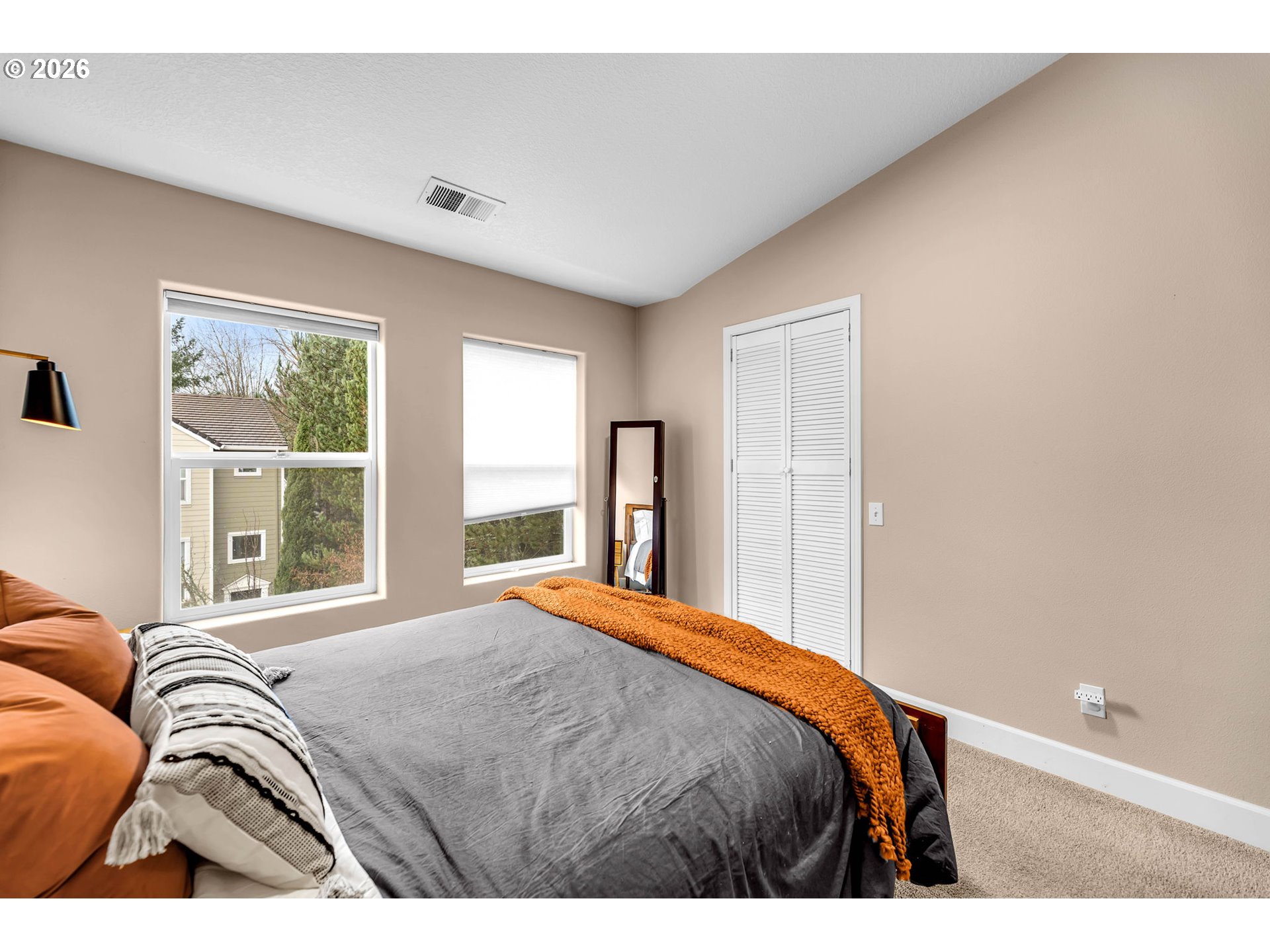2974 Northwest Kennedy Court, Unit 1 Portland, OR 97229 - Photo 22 of 37 a bedroom with a bed and a window