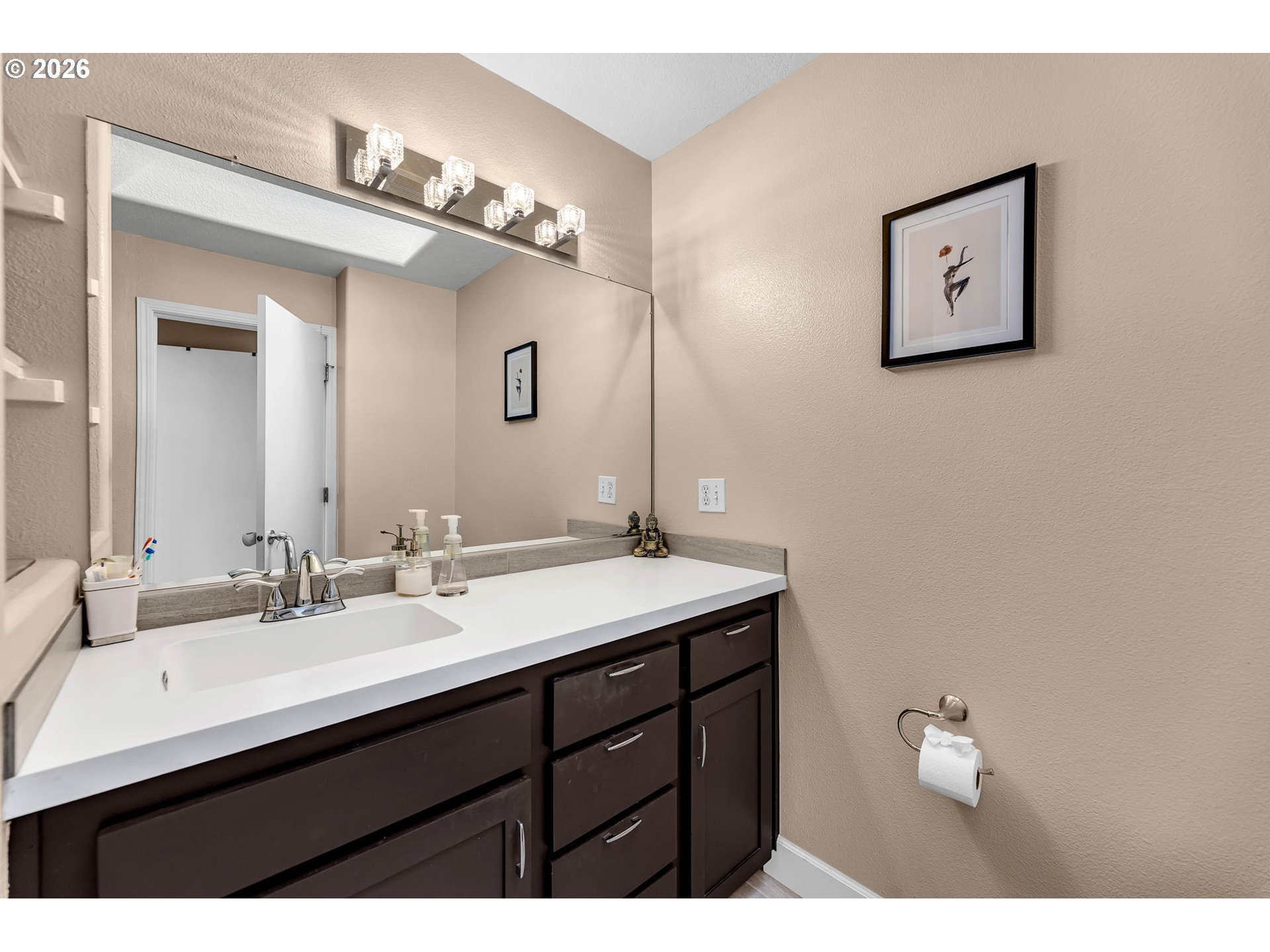 2974 Northwest Kennedy Court, Unit 1 Portland, OR 97229 - Photo 24 of 37 a bathroom with a sink and a mirror