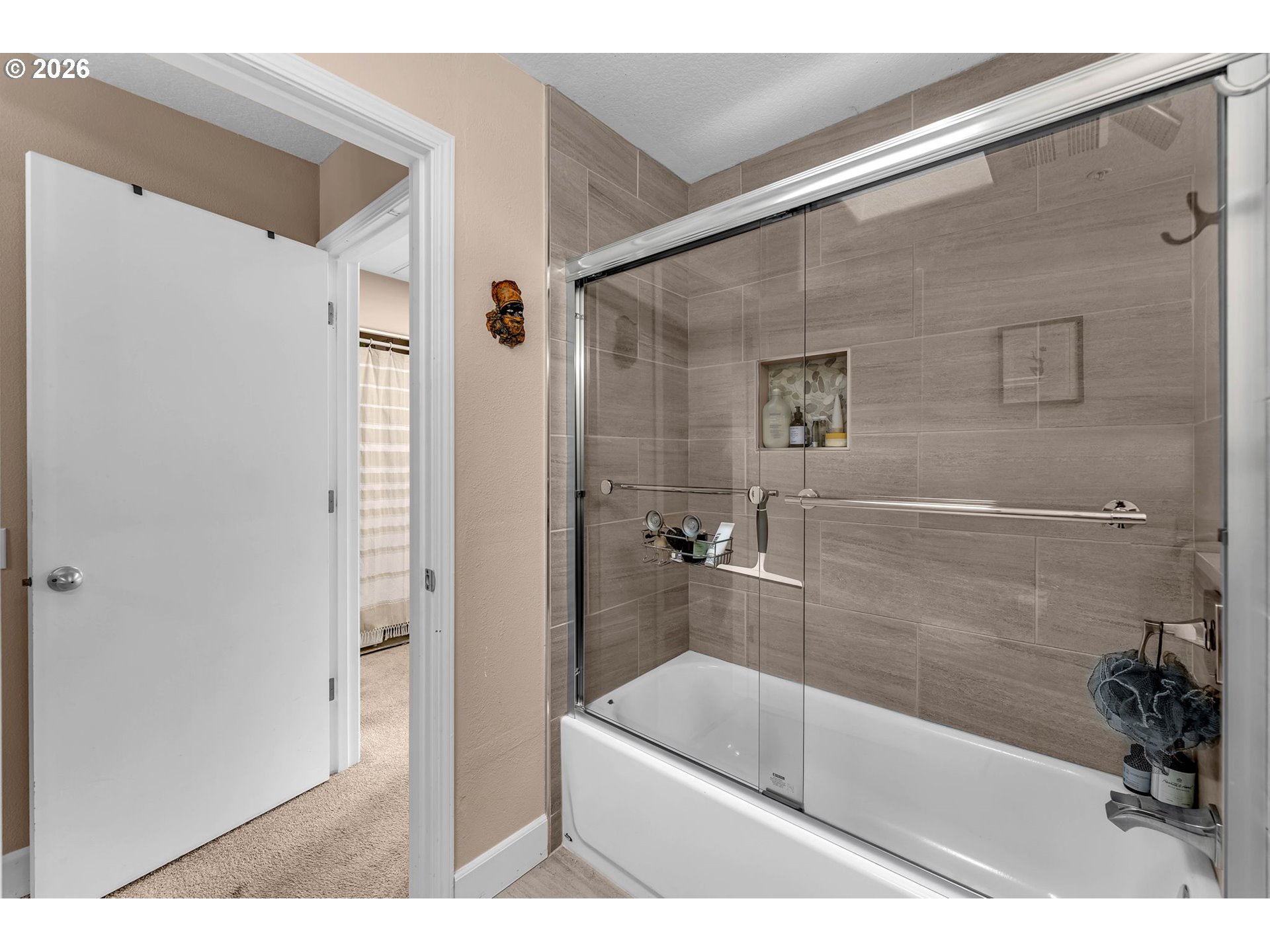 2974 Northwest Kennedy Court, Unit 1 Portland, OR 97229 - Photo 25 of 37 a bathroom with a bathtub and a shower